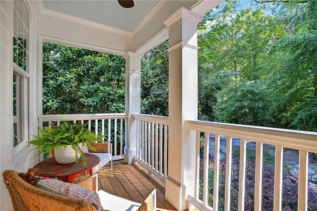 Covered porch with view of scattered trees