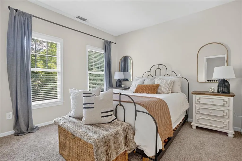 Bedroom with carpet and baseboards