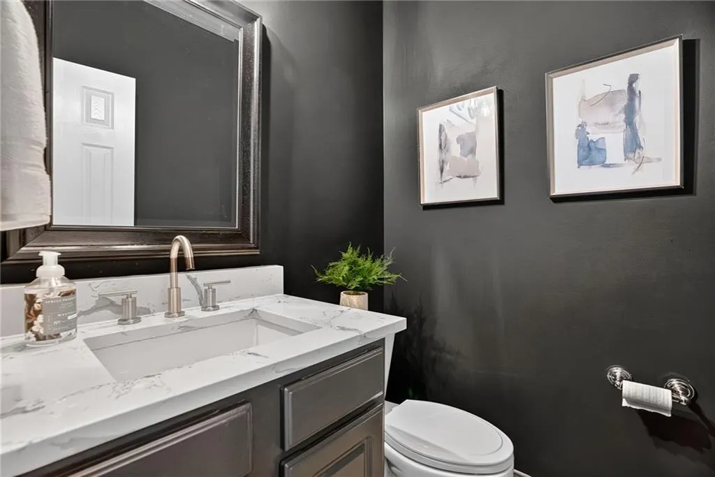 Half bath with toilet and vanity