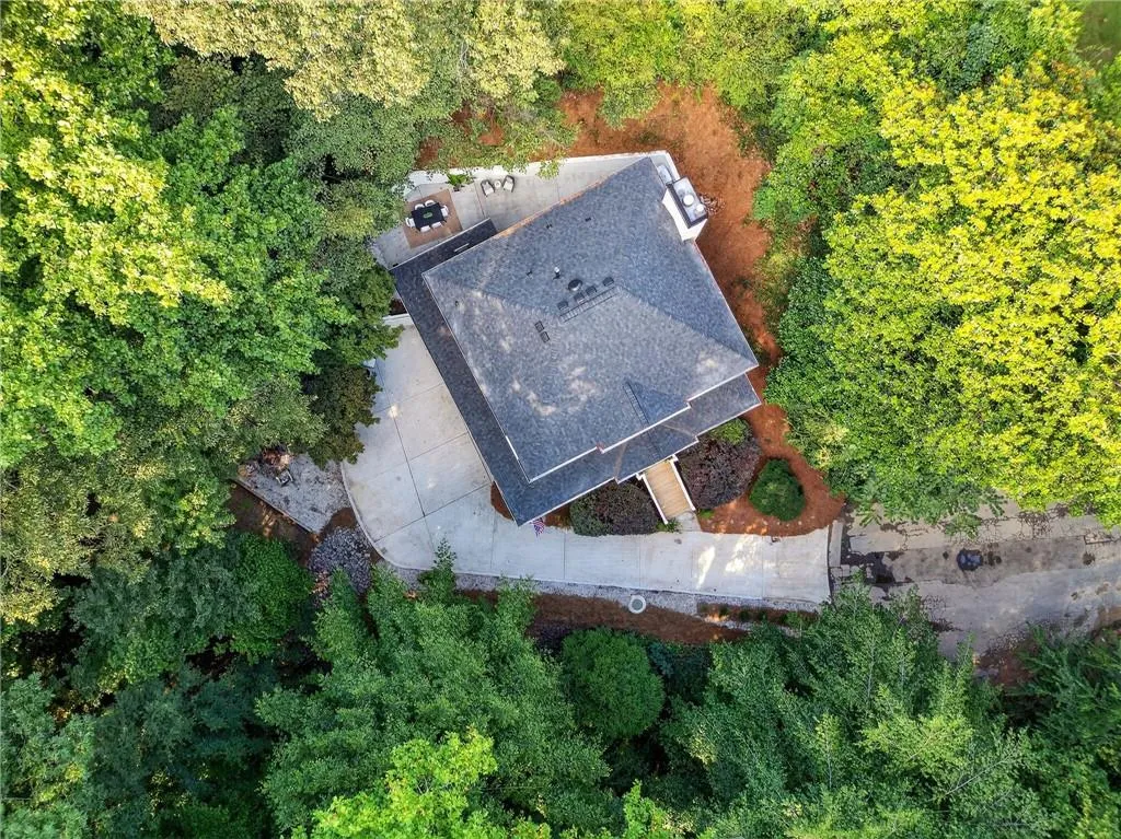 View from above of property with a forest