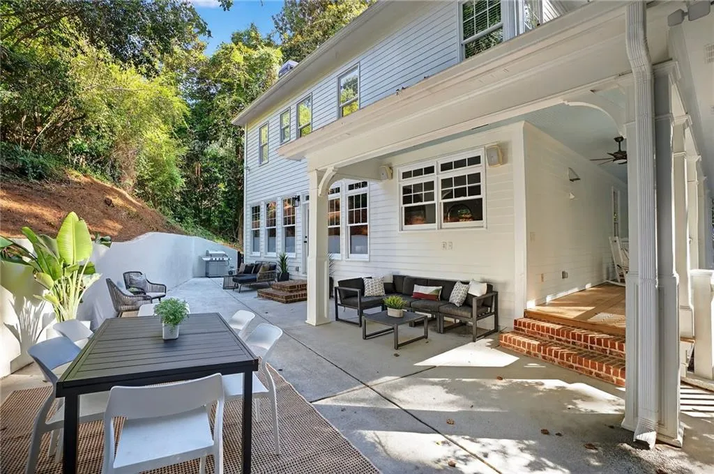 View of patio with an outdoor living space, outdoor dining space, and a ceiling fan