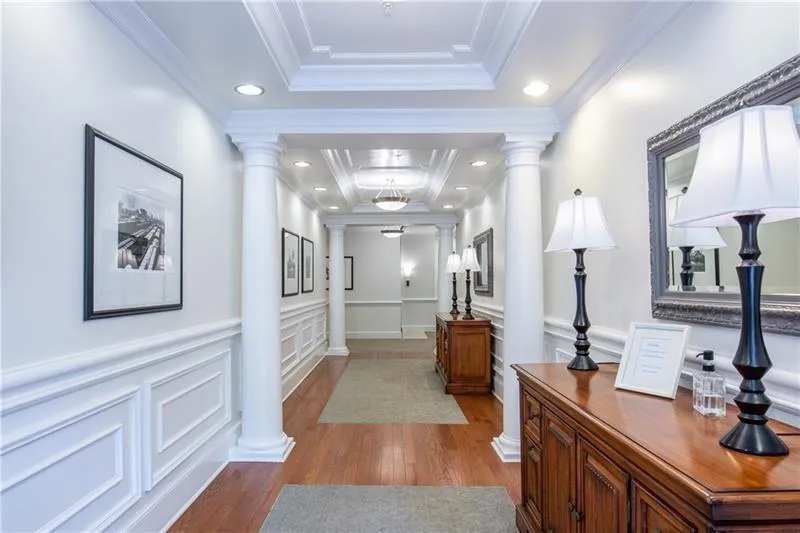 Entry foyer kjkjkll wainscoting, recessed lighting, and crown molding