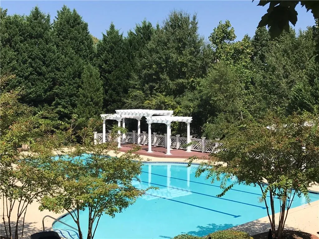 Swimming pool with a pergola