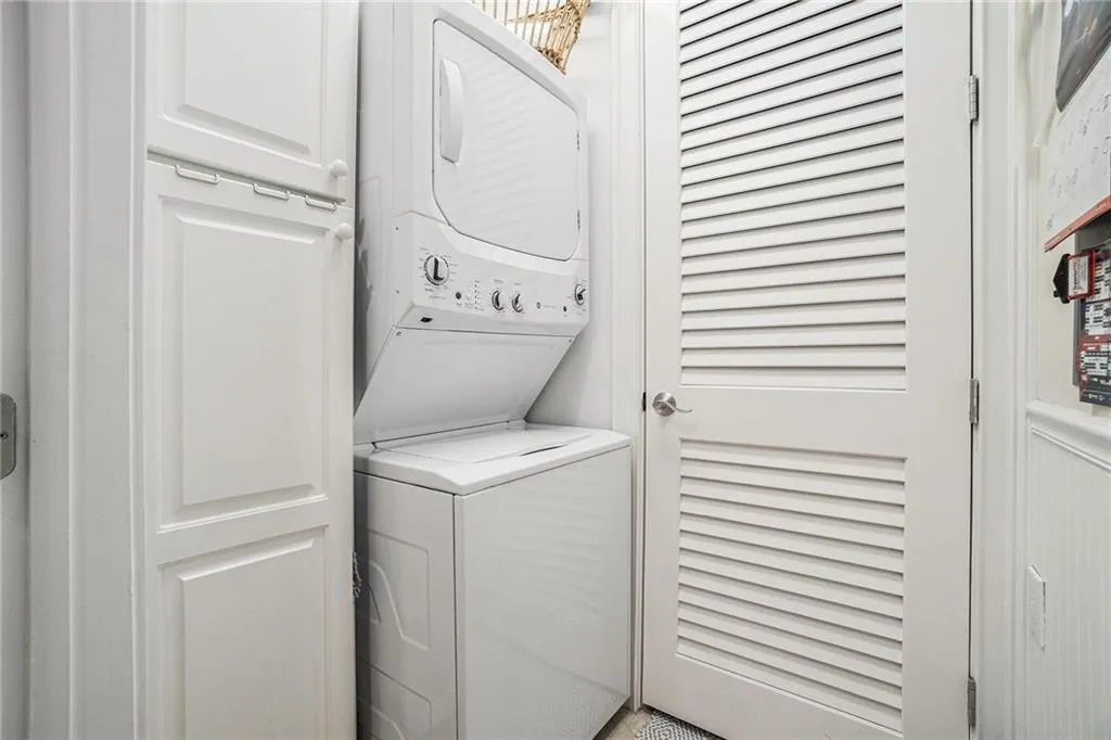 Laundry room with GE stacked washer / drying machine