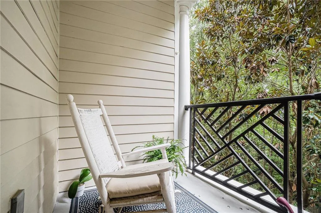 View from balcony overlooking wooded views.