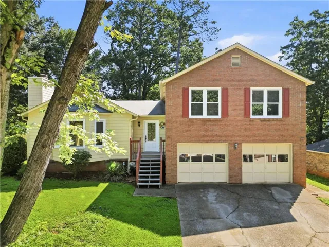 Brick and siding exterior with a two-car garage
