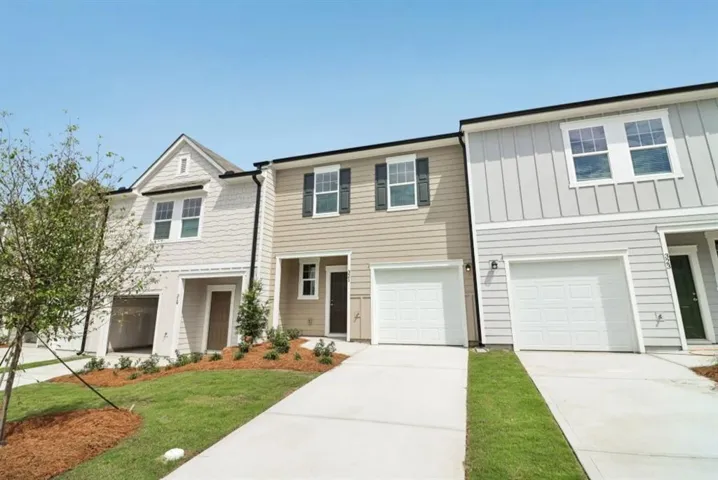 Contemporary townhome exteriors featuring horizontal and vertical siding