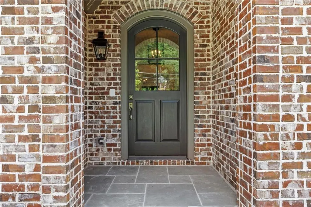 Property entrance featuring beautiful brick