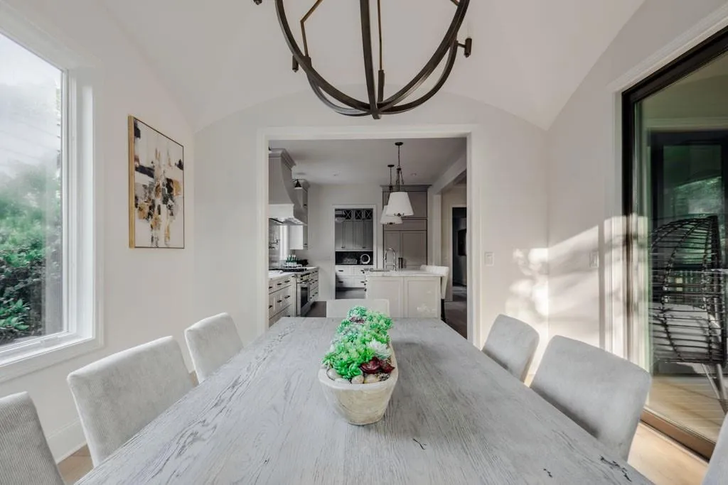 Dining area with a chandelier and lofted ceiling