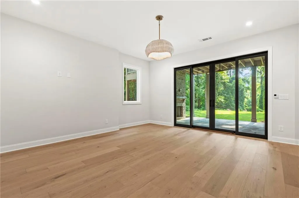 Terrace level rec/media room with outdoor patio