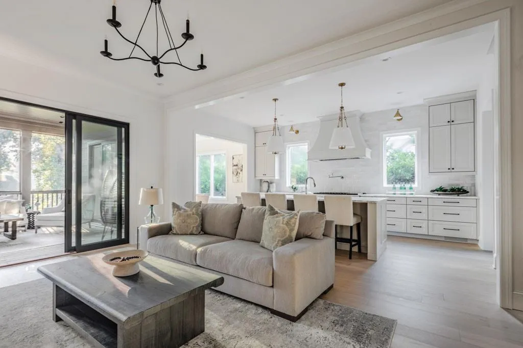 Living area featuring light wood-style flooring and a chandelier
