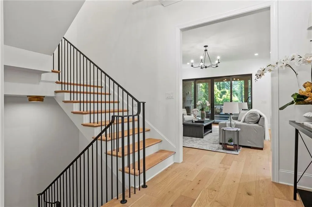 Stairway with custom wrought iron railing