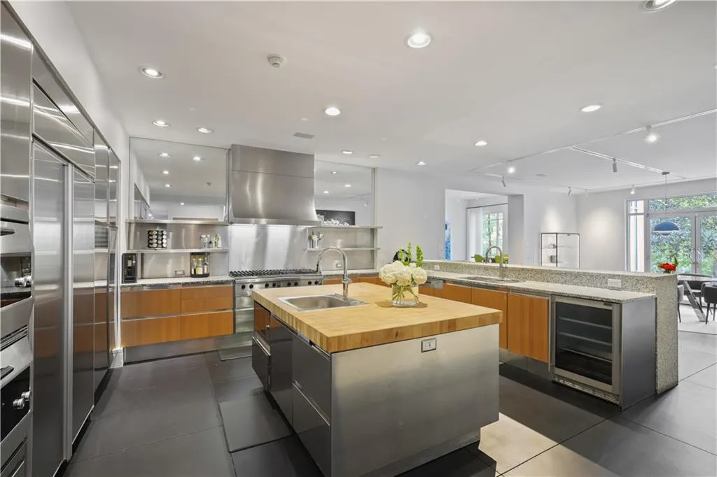 Top-of-the-line appliances and view to breakfast room and private backyard
