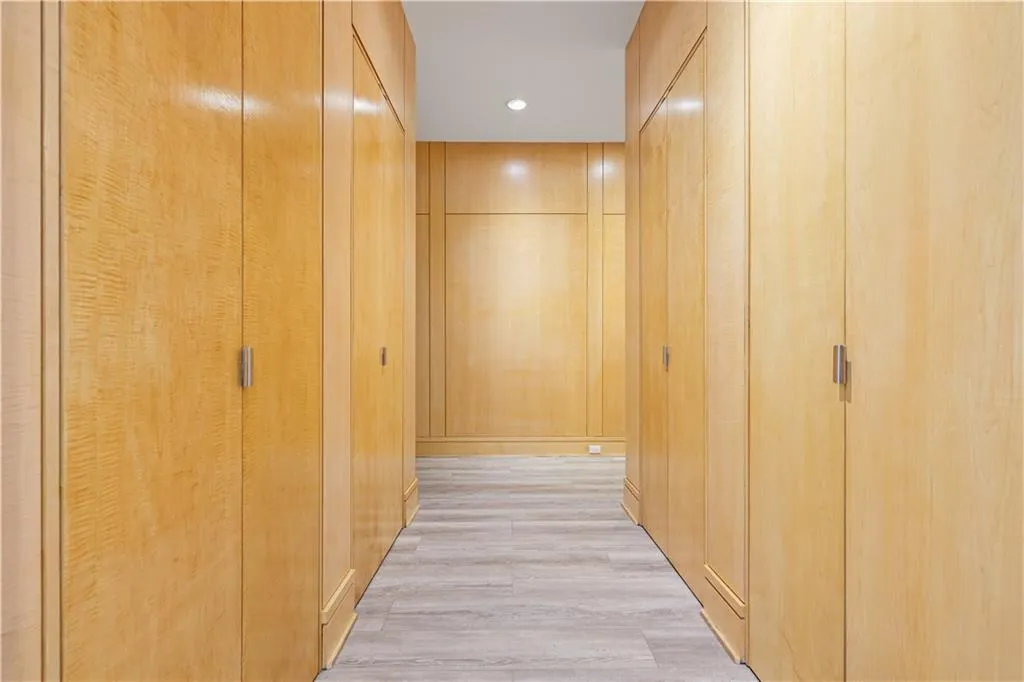 Custom hidden closets leading to the primary suite