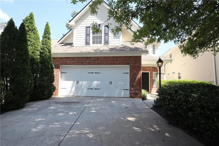 Brick and siding exterior with a two-car garage