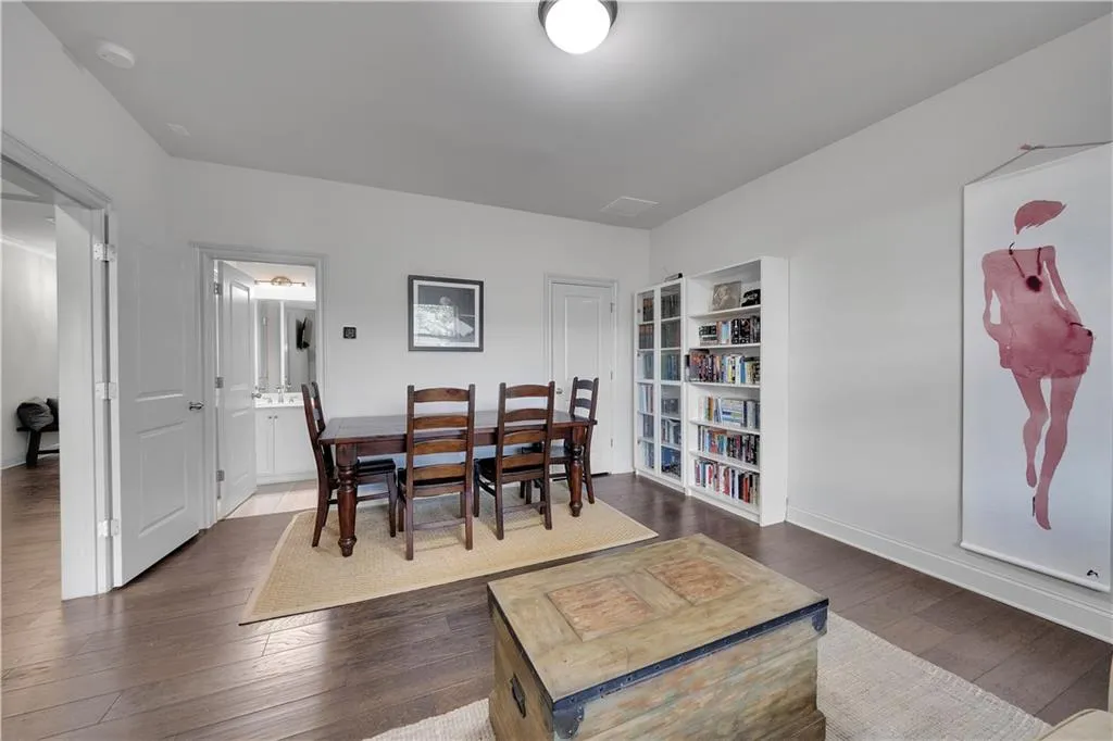 Dining space with baseboards and hardwood / wood-style floors