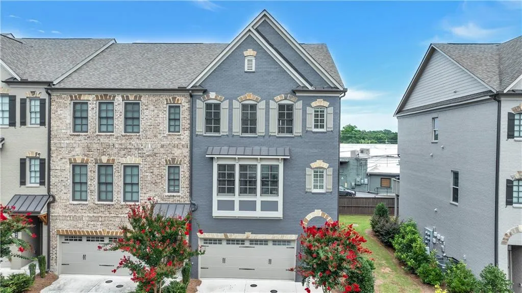 View of front of house featuring brick siding, a garage, and concrete driveway