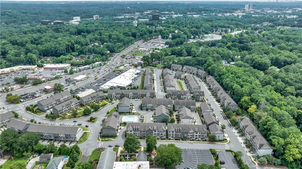 Aerial view of property's location with a forest