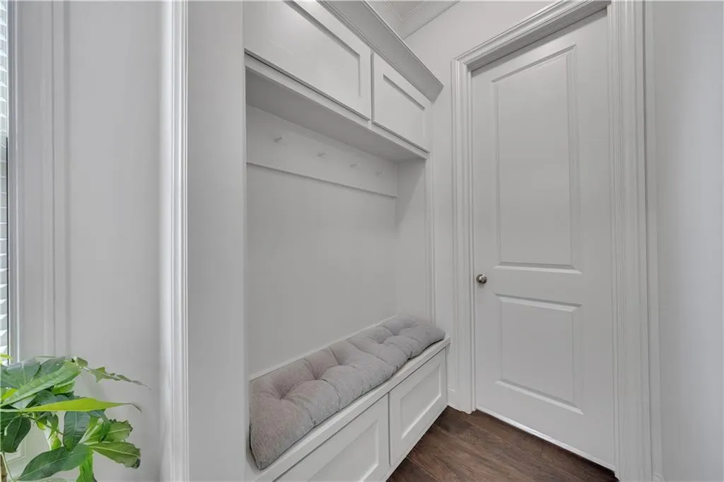 Mudroom with dark wood finished floors