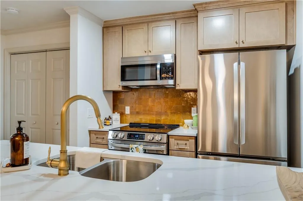 Kitchen featuring new cabinetry, zellige tile backsplash and all new appliances