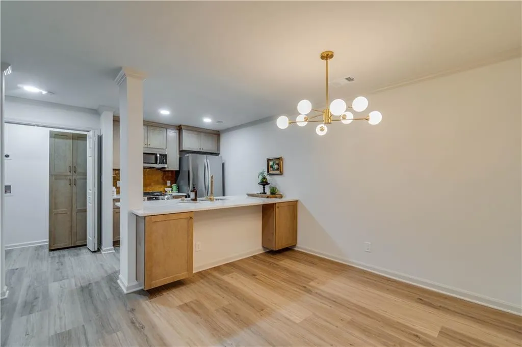 Dining area with bar seating and extra storage at island
