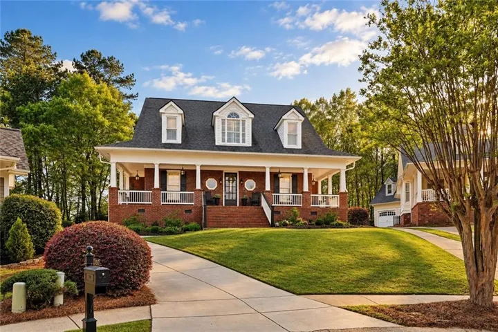 Brick exterior with white columned front porch