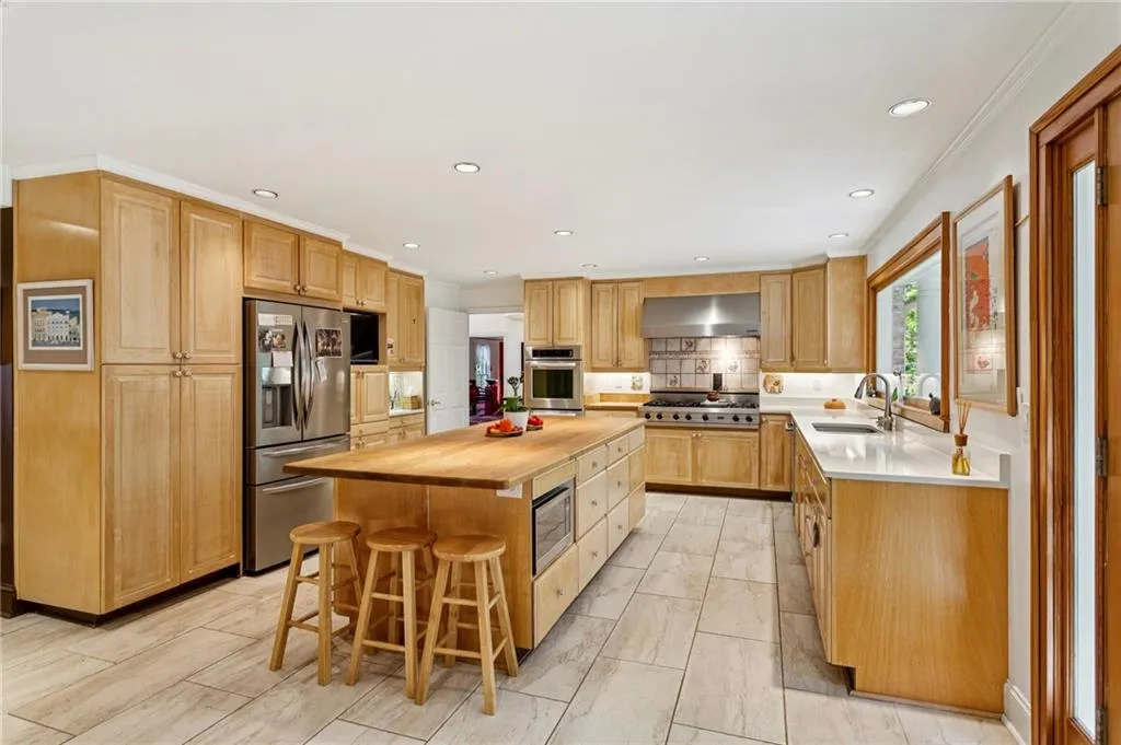 Renovated kitchen with center butcher block island