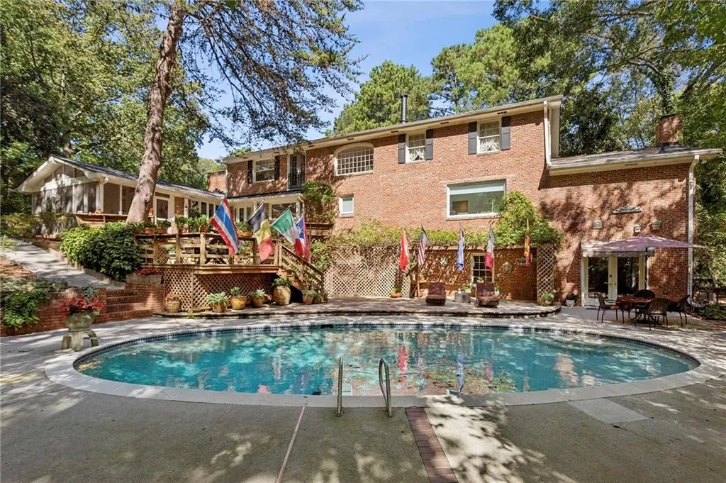 Rear view of house and  pool