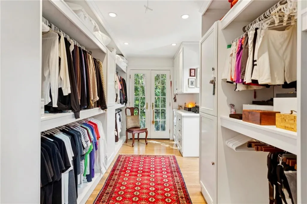 Primary bedroom walk-in closet