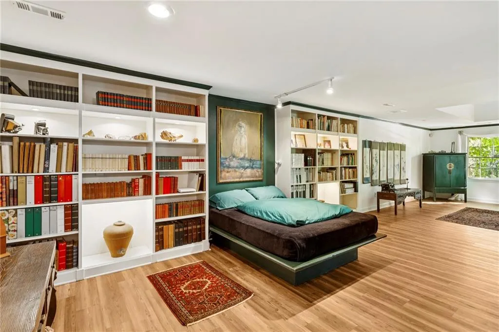 Terrace level living area with built-in bookcases and Murphy bed