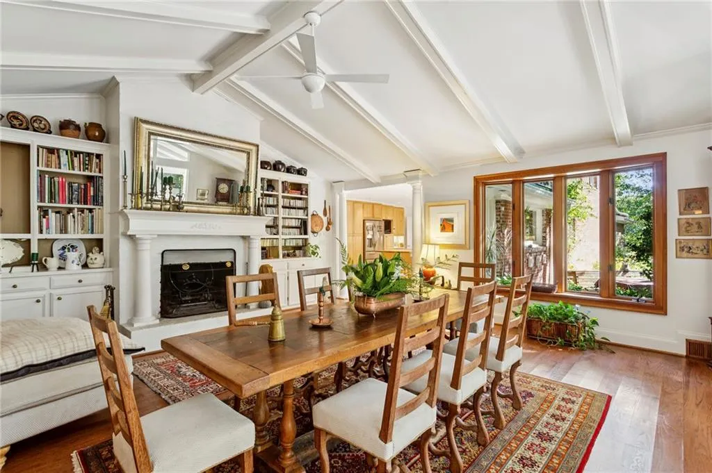 Vauted family room with built-in bookcases and fireplace