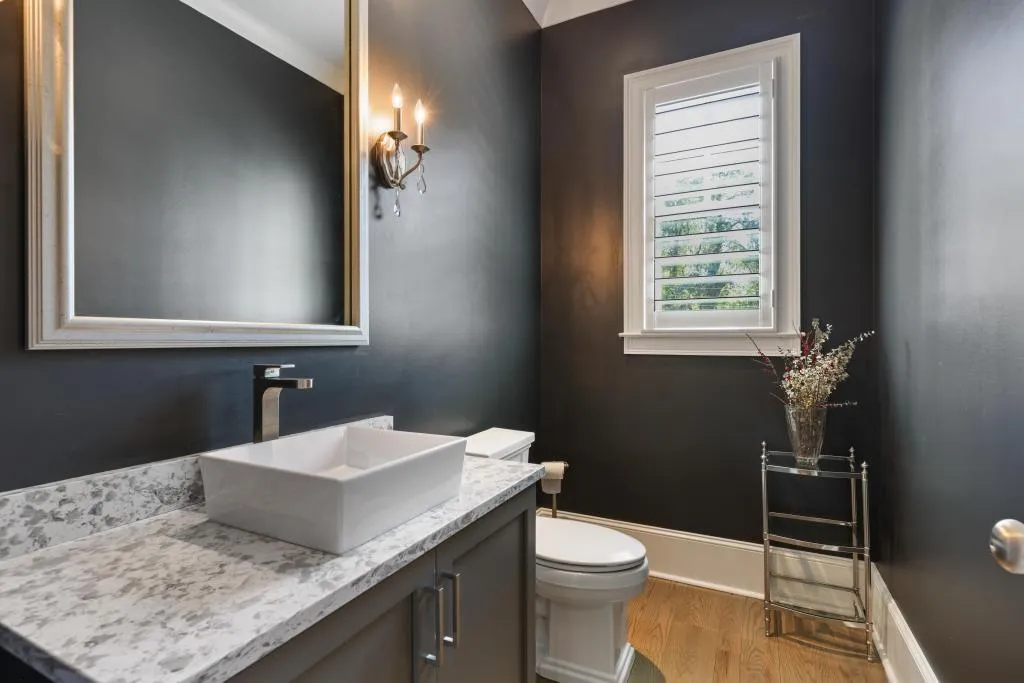 Bathroom featuring vanity and light wood finished floors