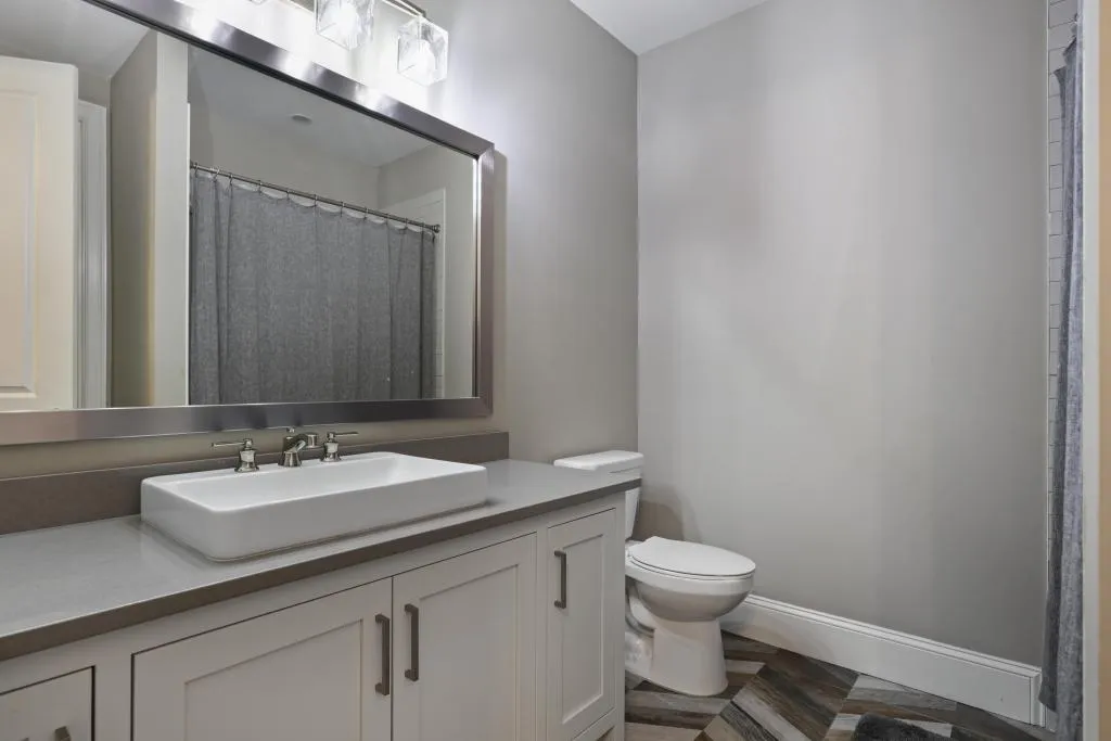 Bathroom with vanity and a shower with shower curtain