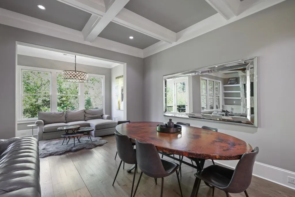 Dining area with coffered ceiling, hardwood / wood-style floors, plenty of natural light, and recessed lighting