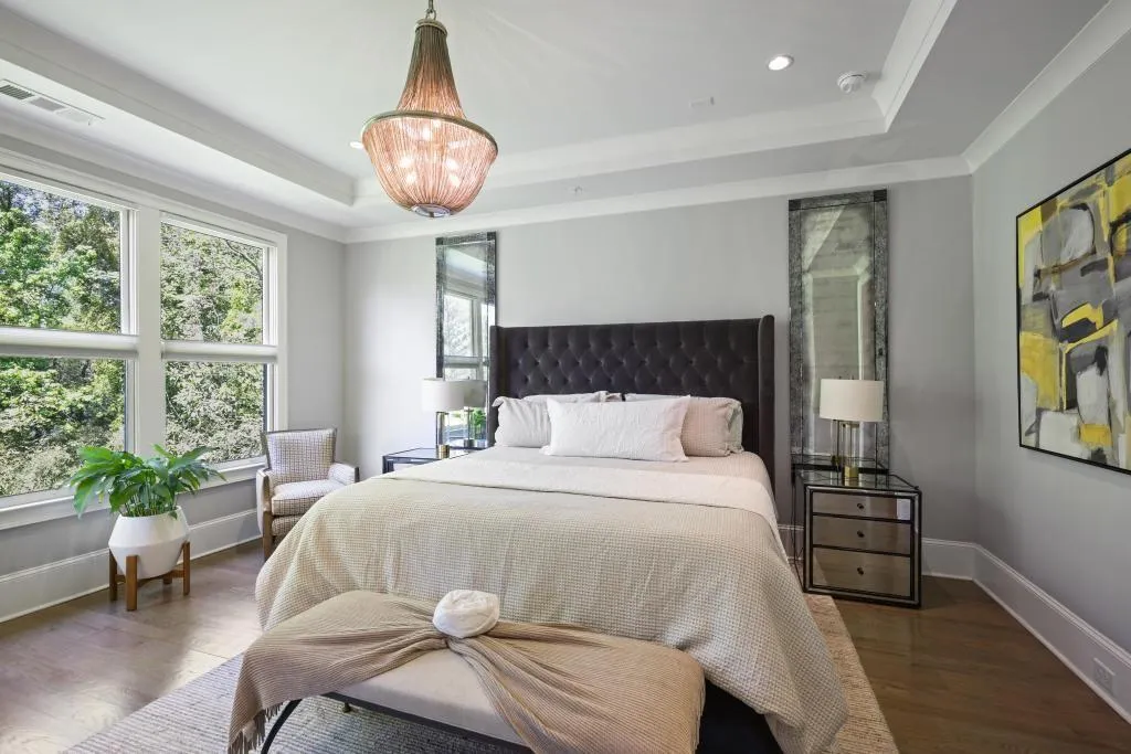 Bedroom featuring dark wood-style flooring, crown molding, and recessed lighting