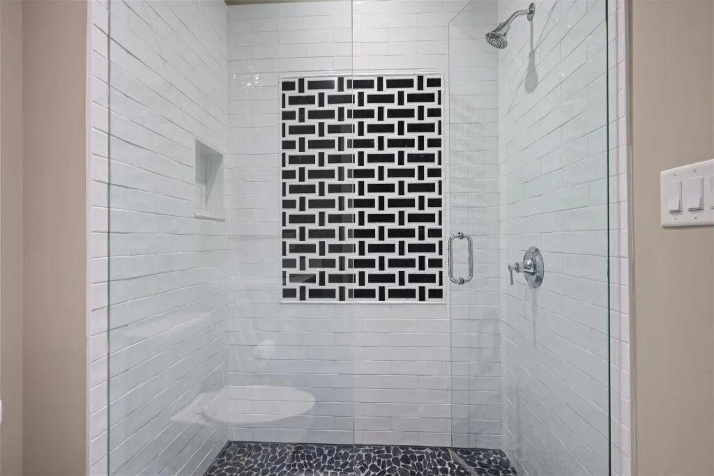 Bathroom featuring a shower stall