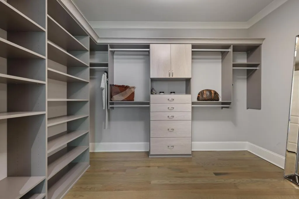 Walk in closet featuring dark wood-style flooring