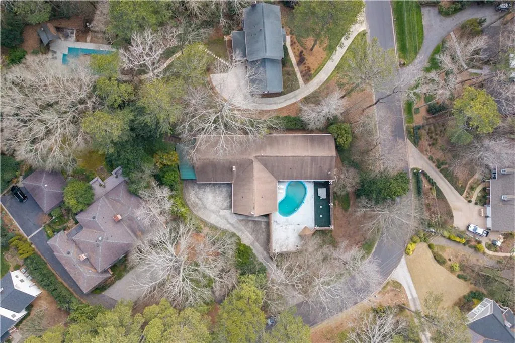 Aerial overview of property's location featuring a pool area
