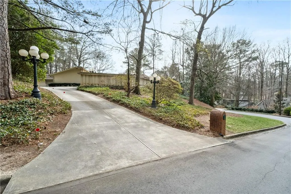 View of home's community featuring concrete driveway