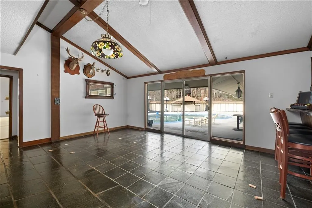 Unfurnished living room with a textured ceiling