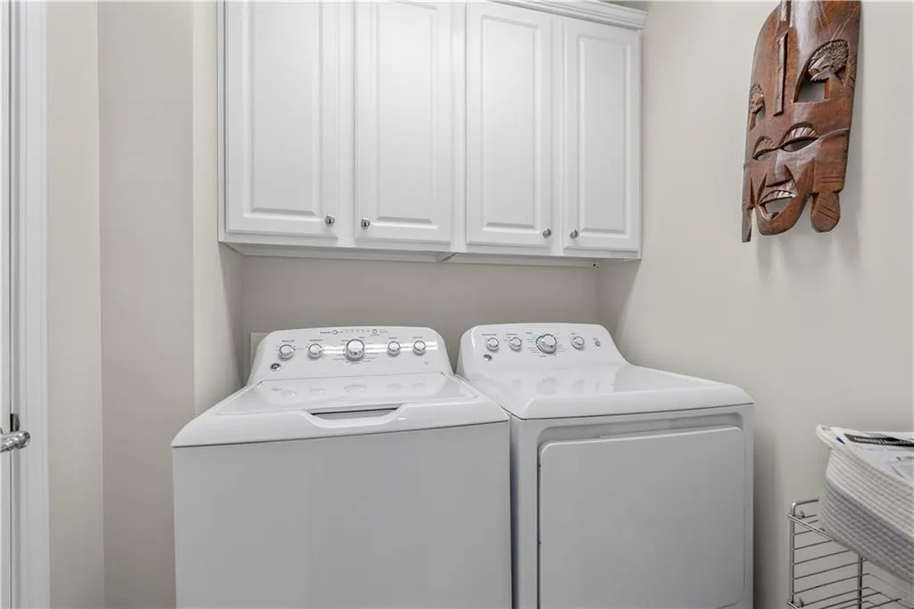 Laundry area with washing machine and dryer and cabinet space