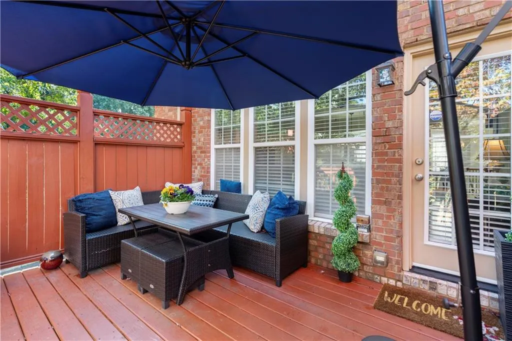 Wooden terrace featuring outdoor dining area
