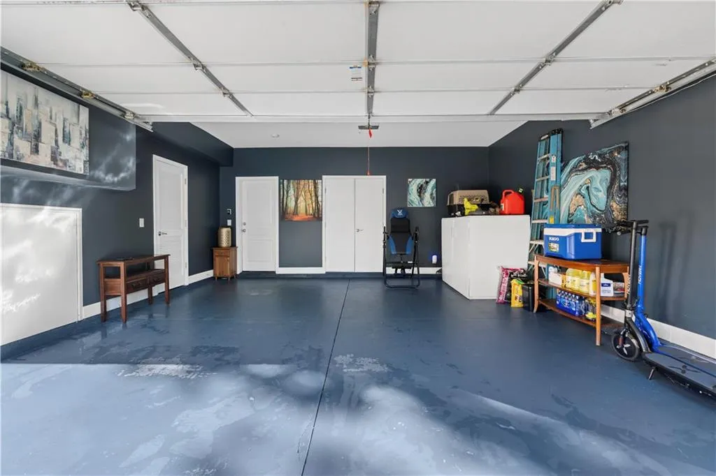 Garage featuring baseboards