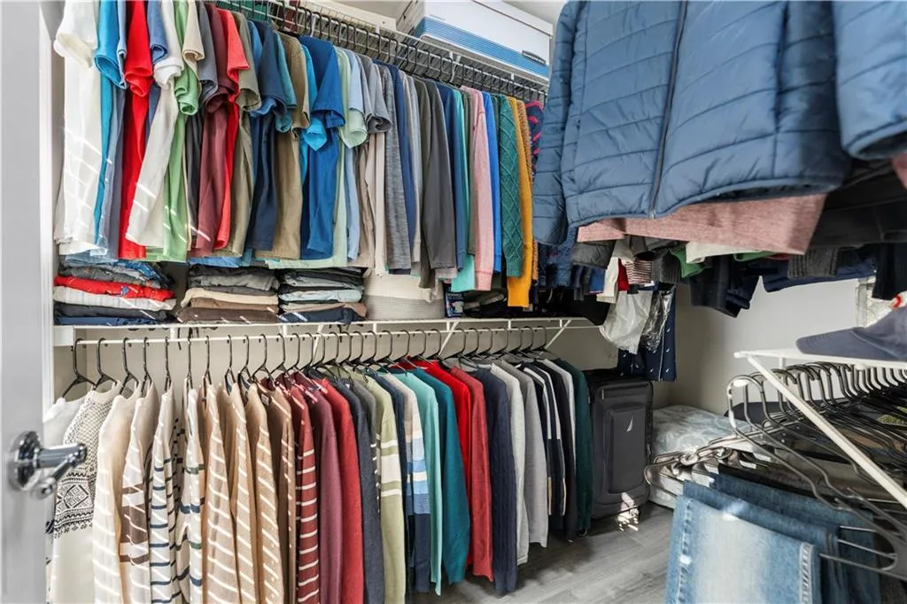 Spacious closet with light wood-style flooring