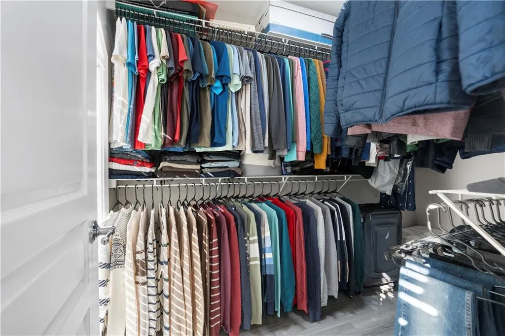 Spacious closet featuring light wood-style floors