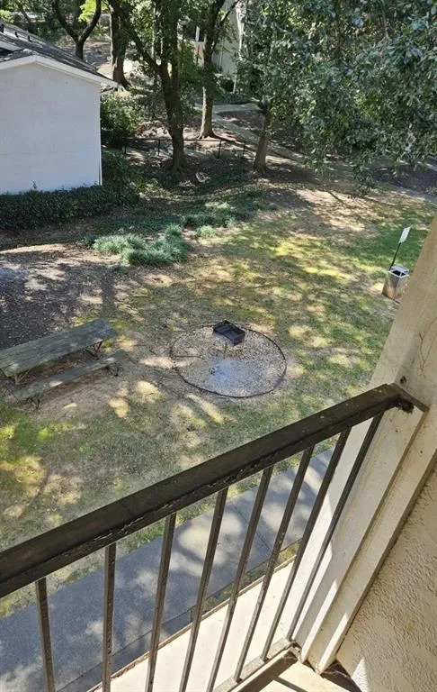 View of yard featuring a balcony