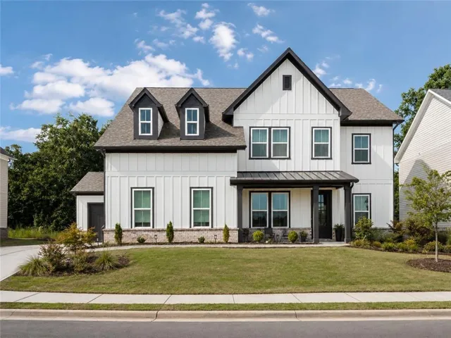 White board-and-batten exterior with dark trim