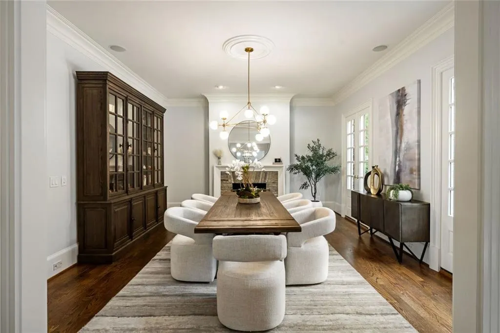 Dining room featuring french doors and wood burning fireplace