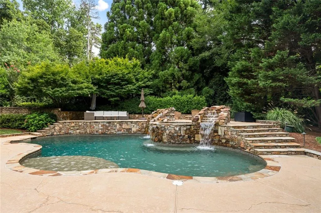 Heated Saltwater pool with waterfalls, sun ledge and raised spa