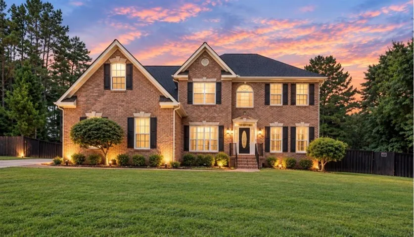 Brick exterior with black shutters